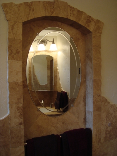 Arch around oval mirror