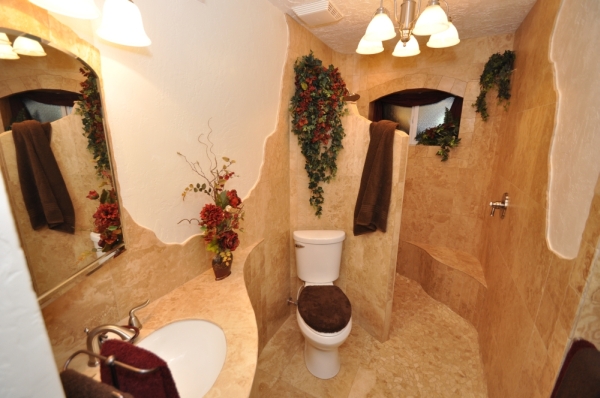 completed bathroom showing vanity, toilet area, shower and floor